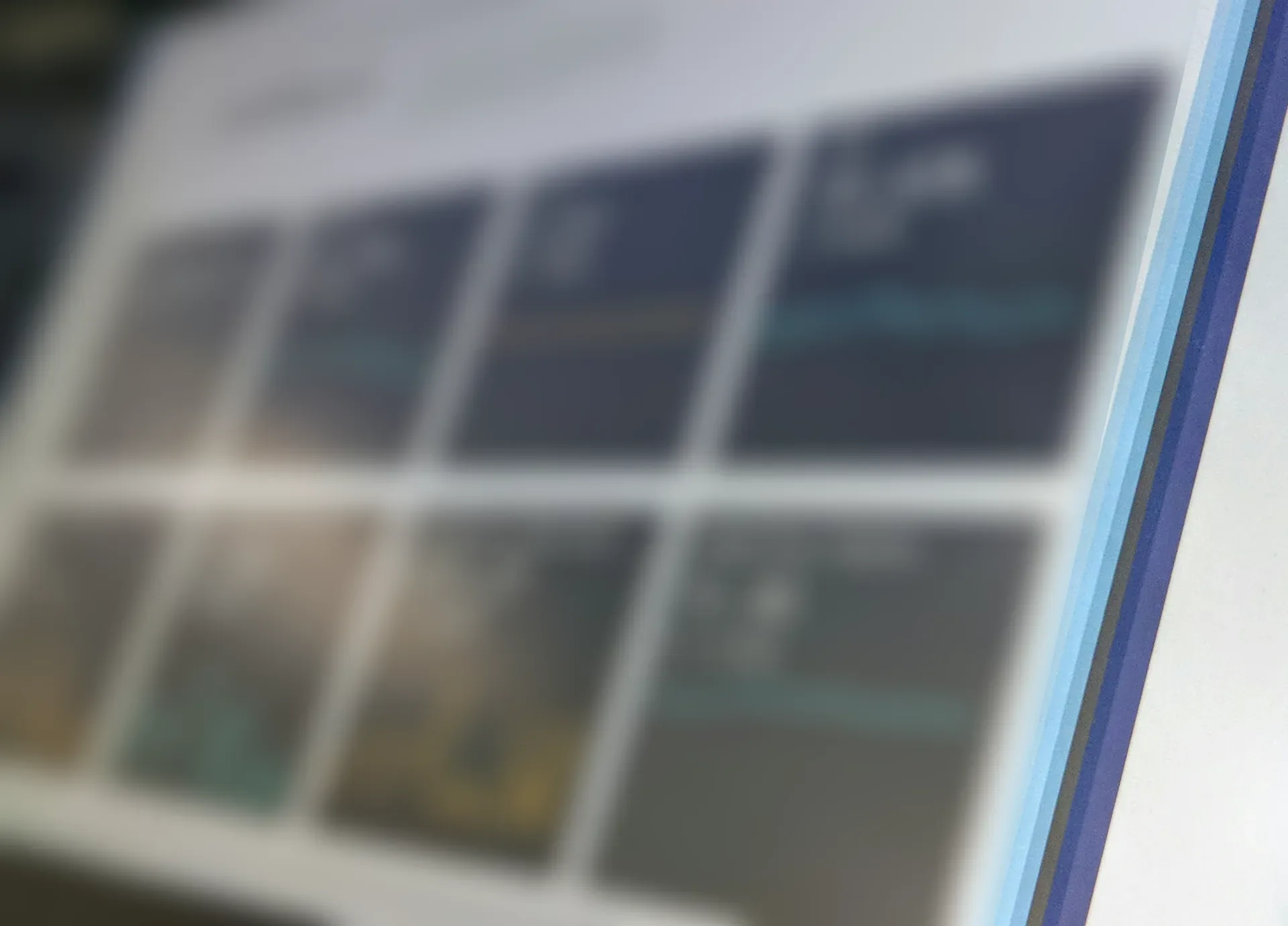 A reporting dashboard on a screen, photographed at an angle and blurred